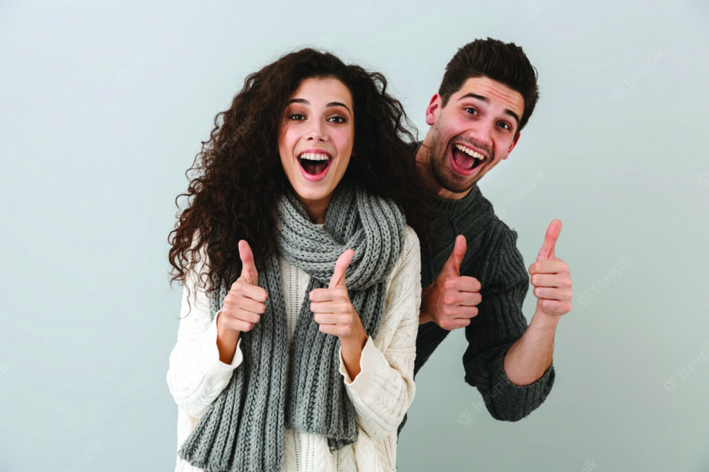Man and Woman with Thumbs Up